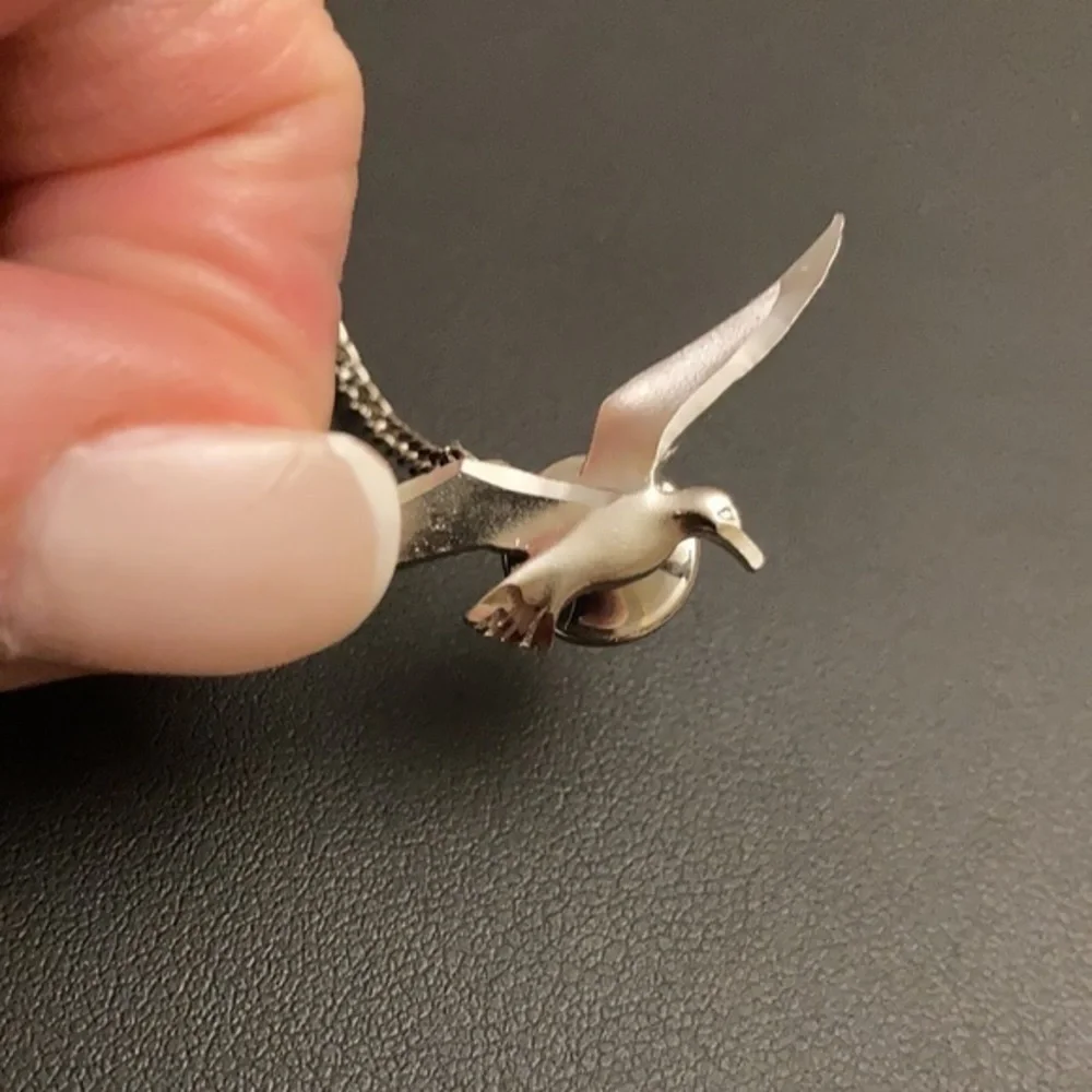 Silver tone tie tack